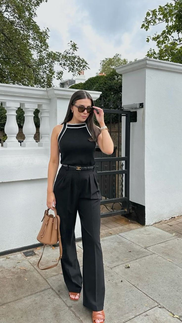 Black sleeveless top with black Aritzia Effortless Pant